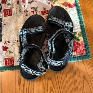 Teva Women’s Black and Light Blue Sandals Size 9.